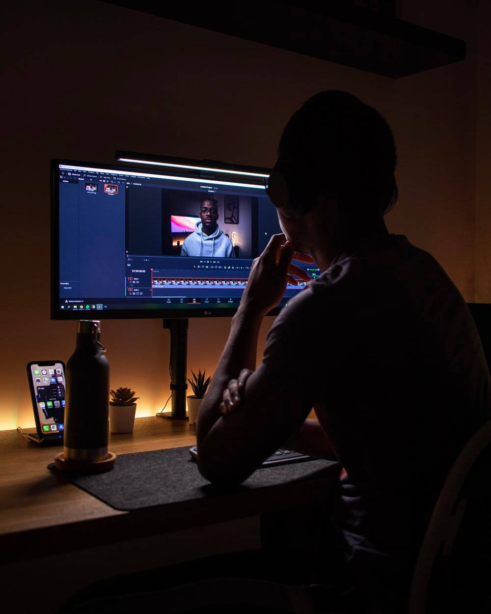 Silhouette Of Man Making Content At Computer Background