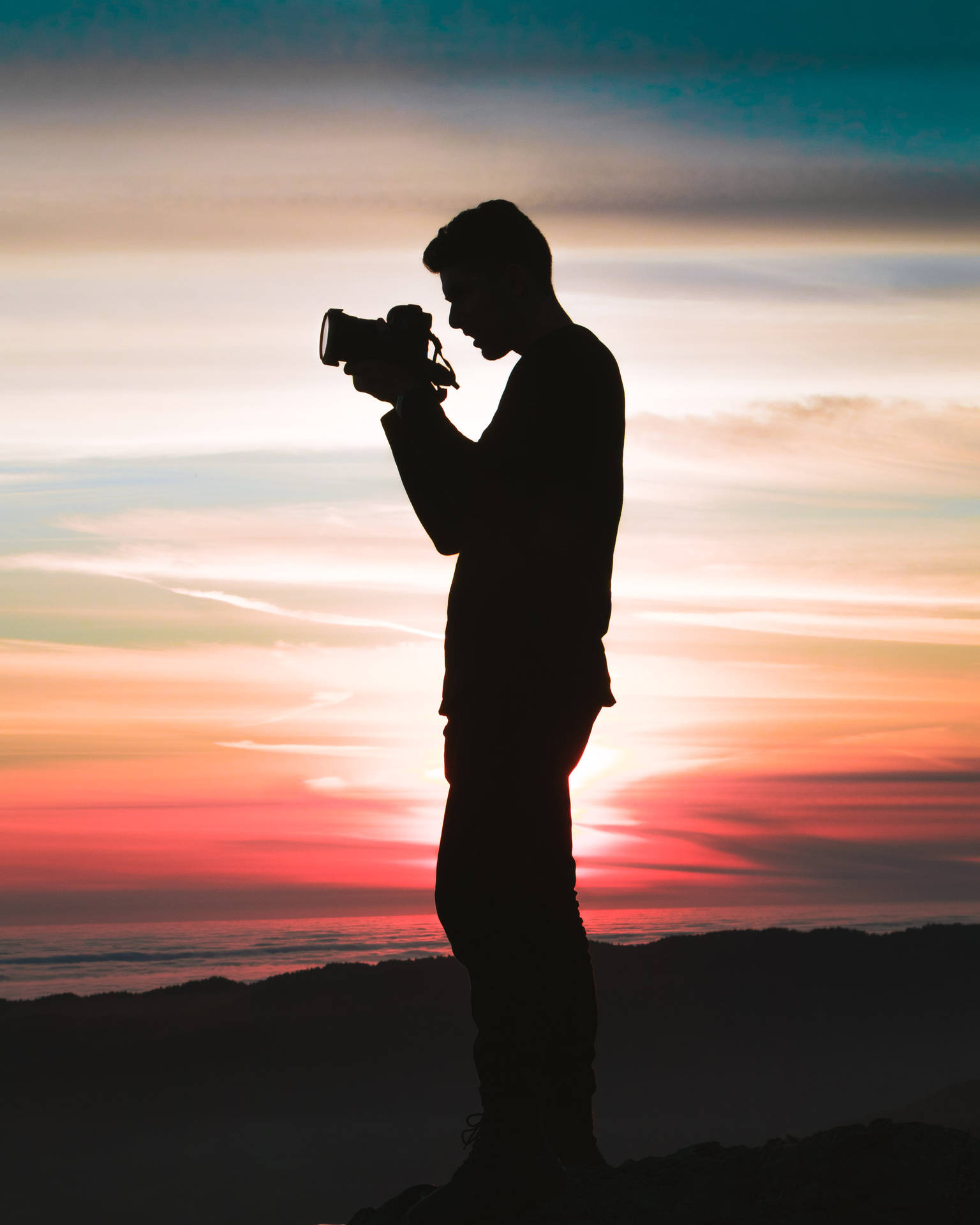Silhouette Of Man Taking Sunset Photography Background
