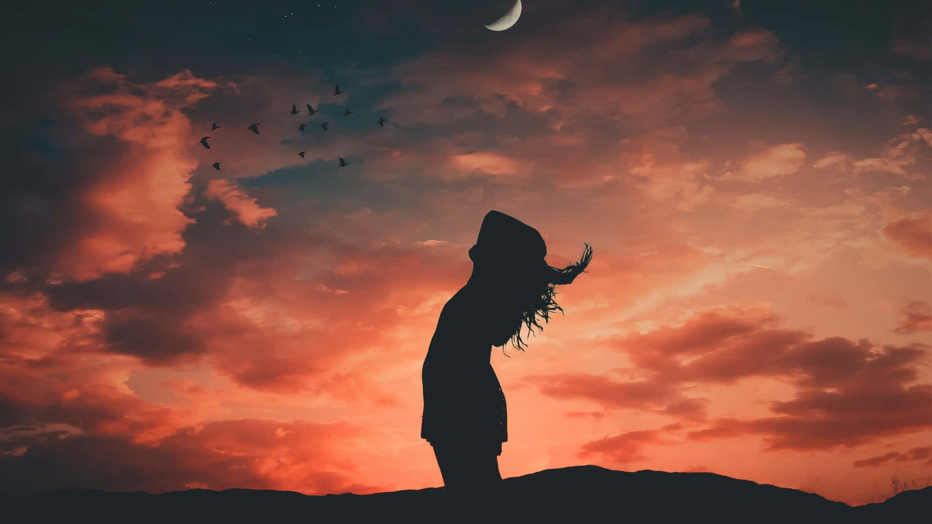 Silhouette Of Woman Under Evening Sky