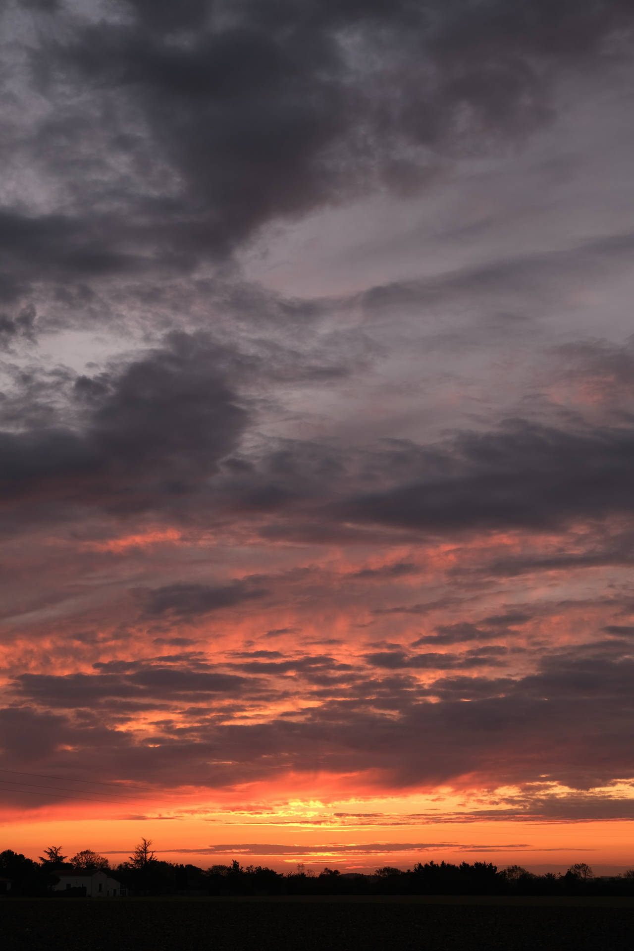 Silhouette Sunset Purple And Orange Cloudy Sky Background