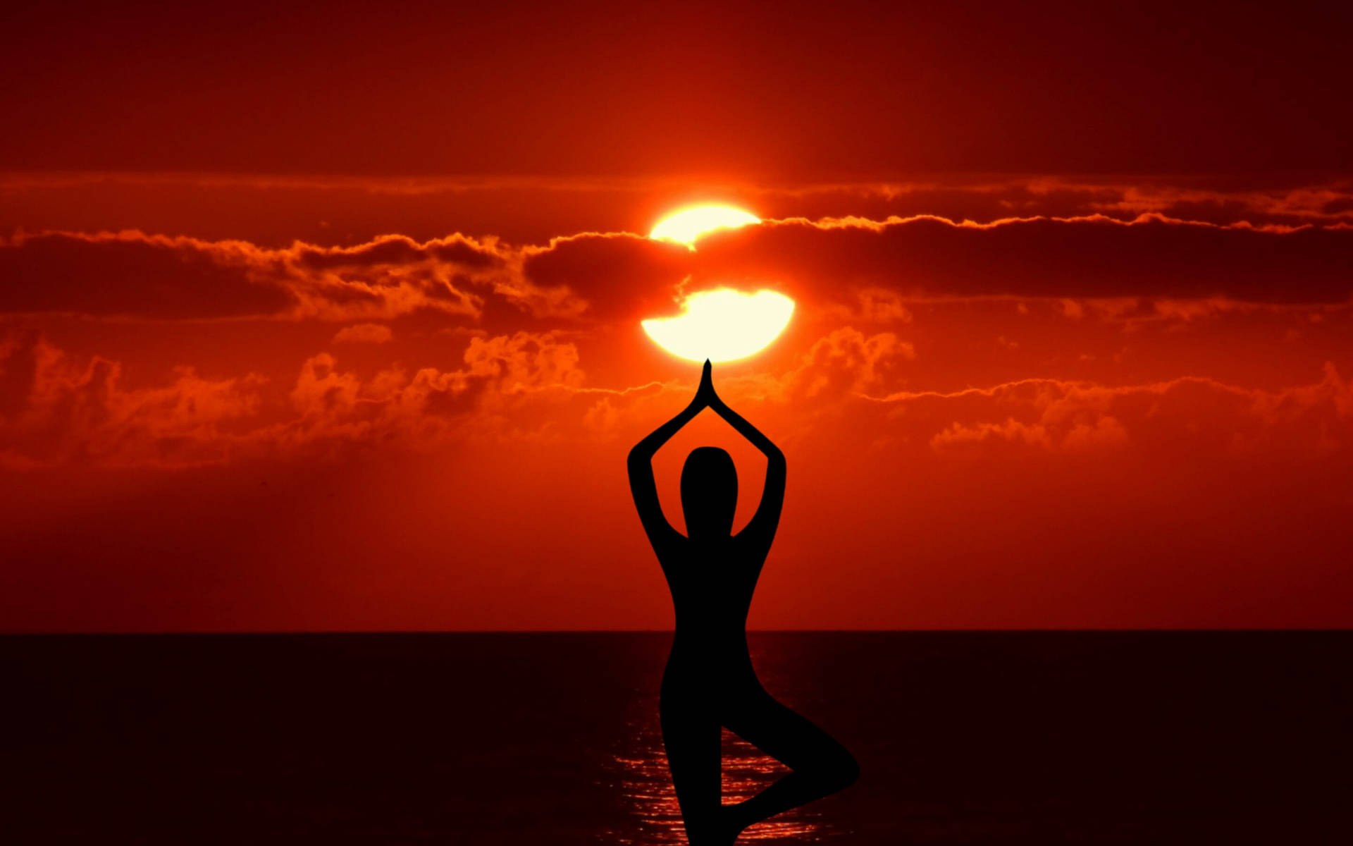 Silhouette Yoga Under Red Sun Background