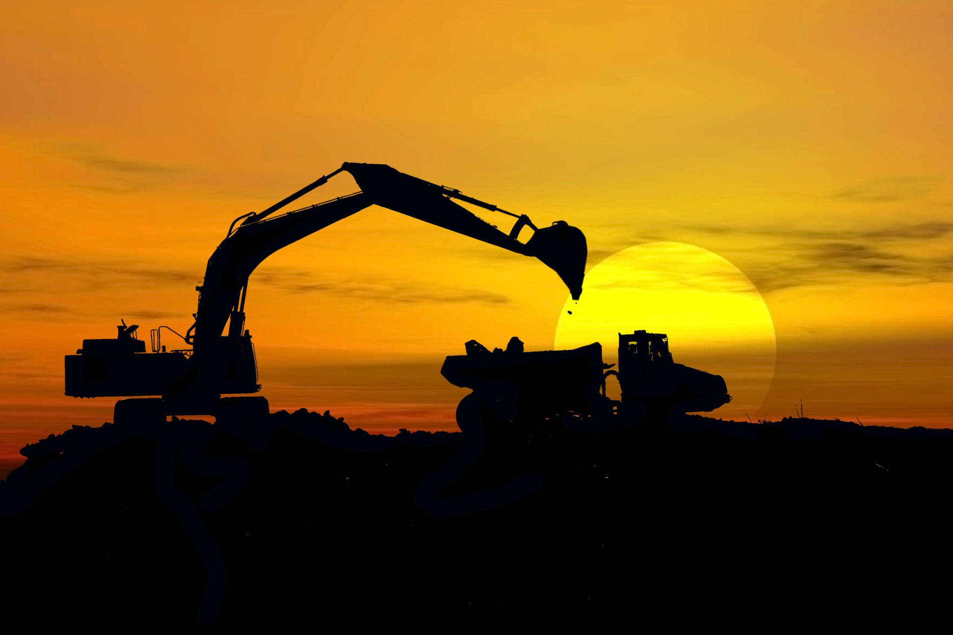 Silhouetted Heavy Construction Machinery