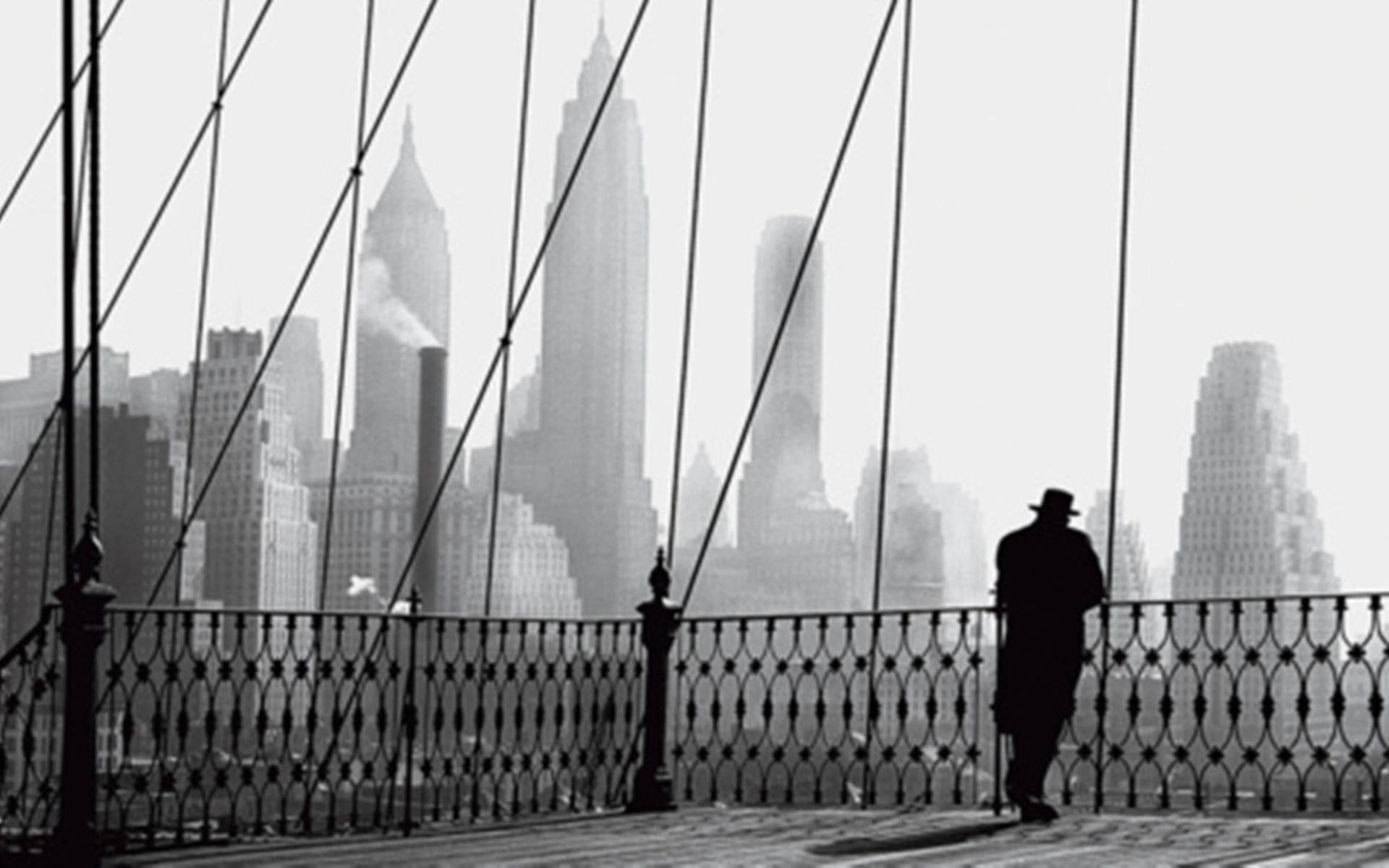 Silhouetted Serenity On The Brooklyn Bridge Background