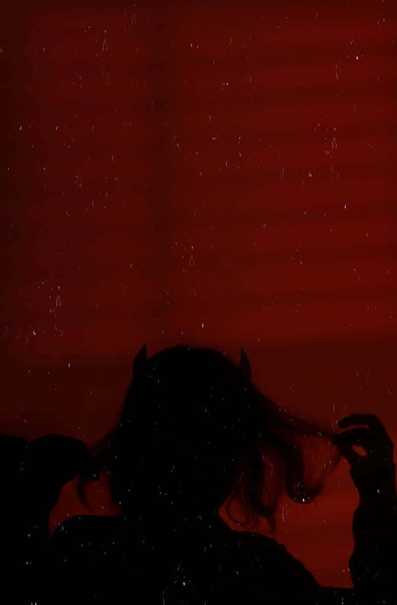 Silhouetteof Demonin Red Ambiance Background