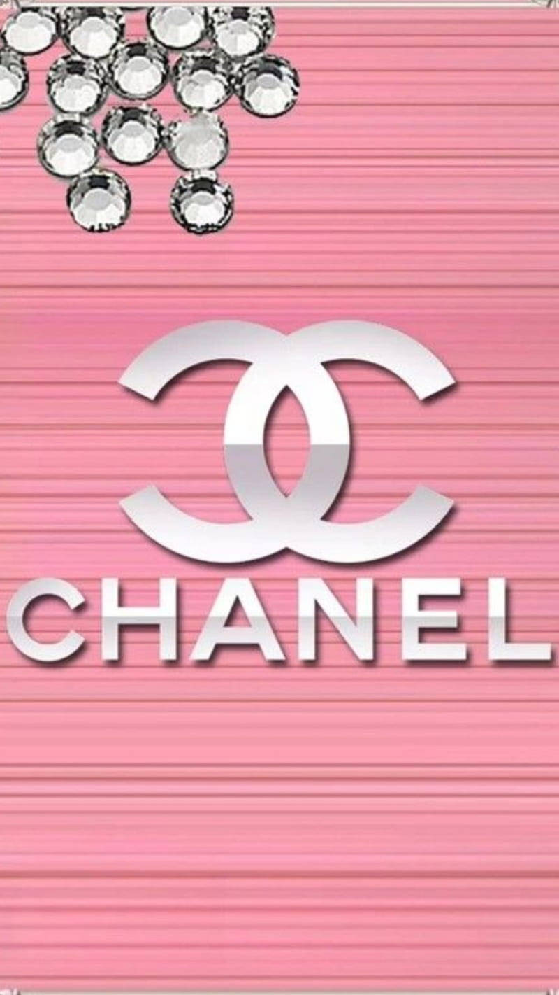 Silver Beads Above Pink Chanel Logo Background