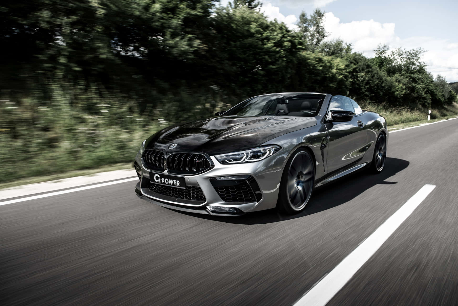 Silver-gray Bmw M8 On The Road 4k Background