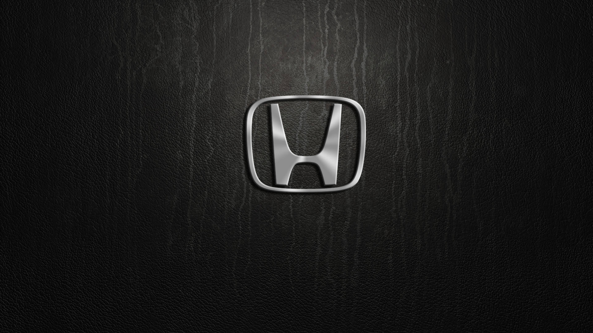 Silver Honda Logo In Solid Black Background