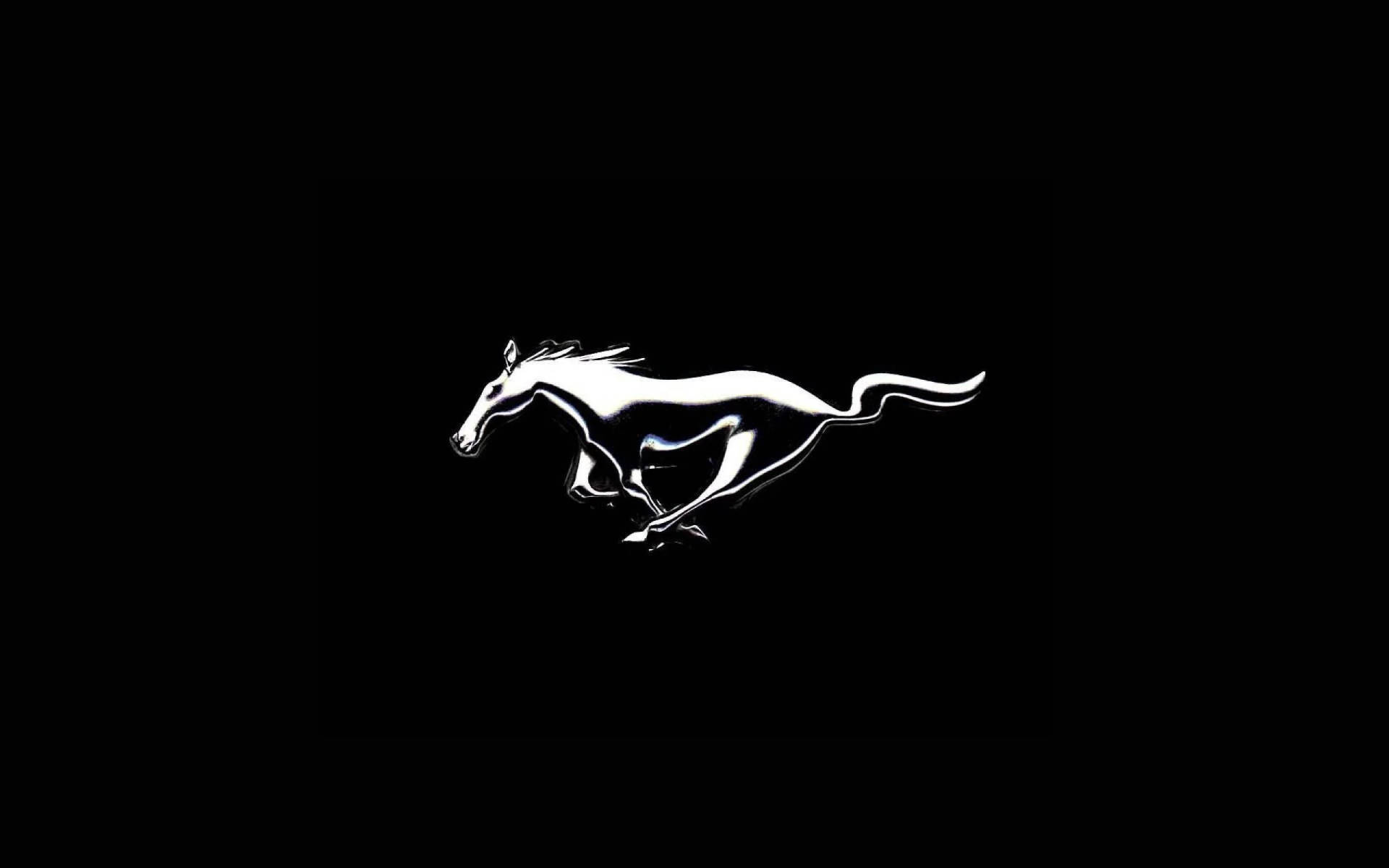 Silver Mustang Emblem In Solid Black Background