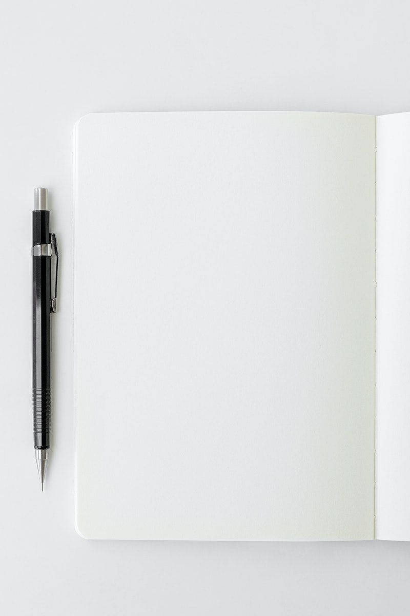 Silver Pen On A Blank Page Background