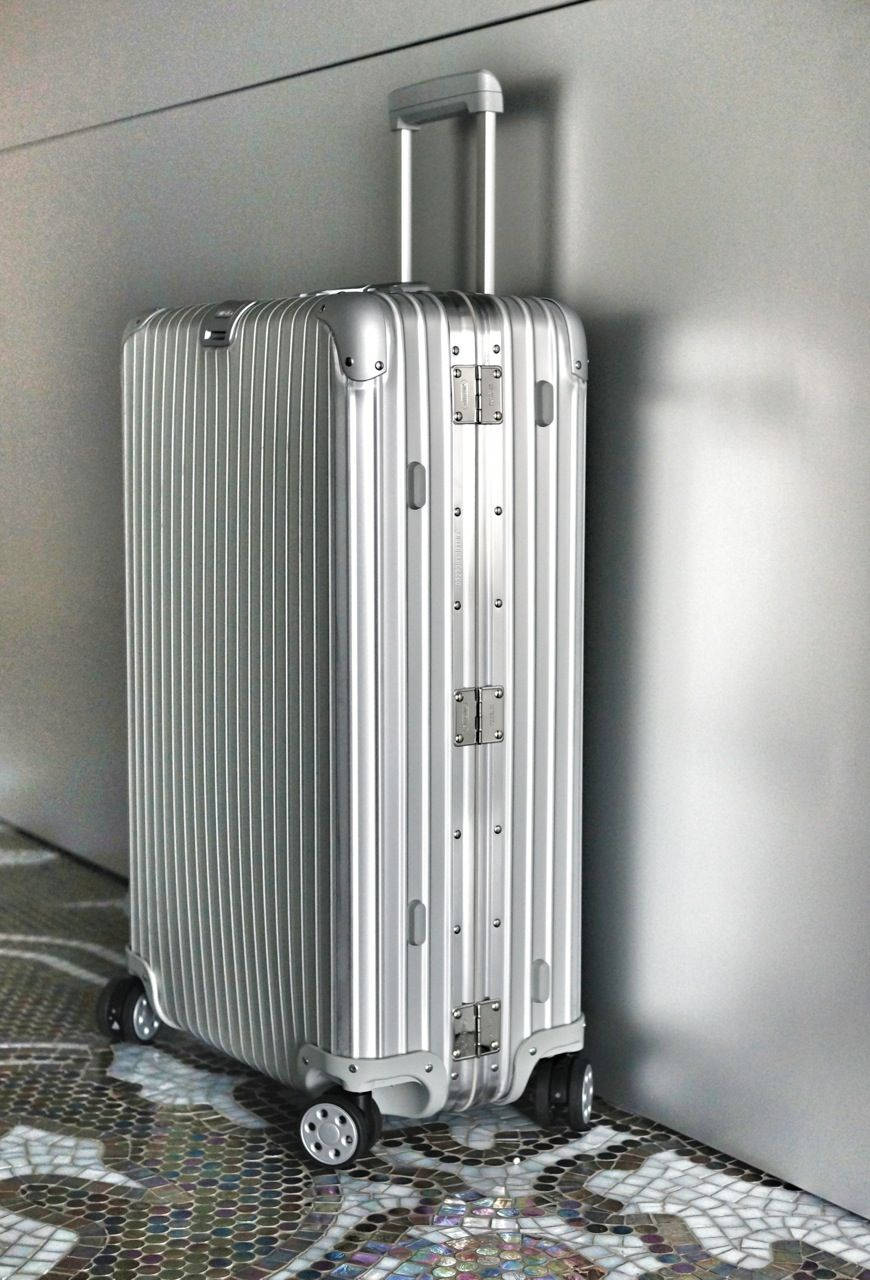 Silver Rimowa With Four Wheels