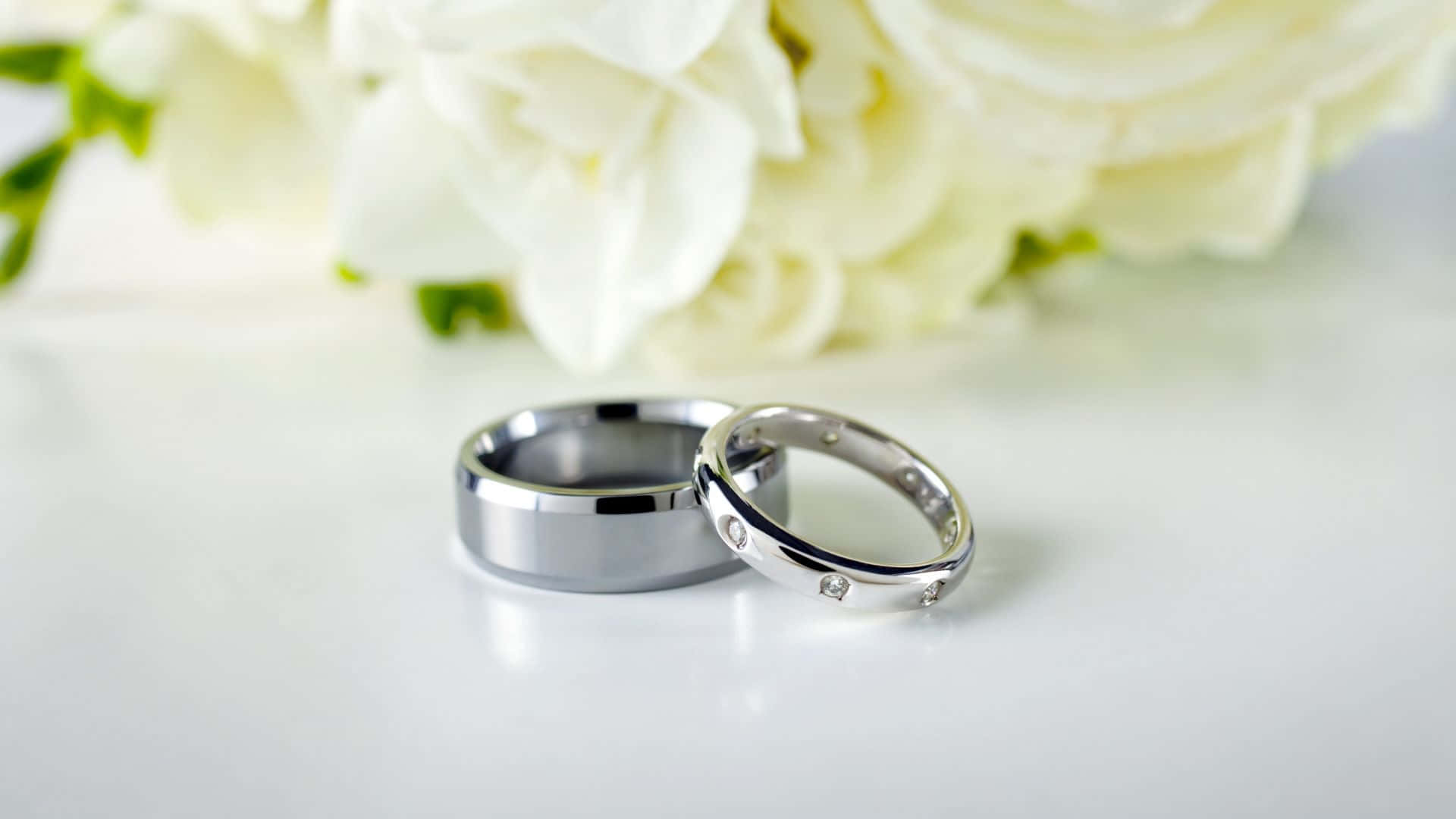 Silver Wedding Ring With White Flowers Background