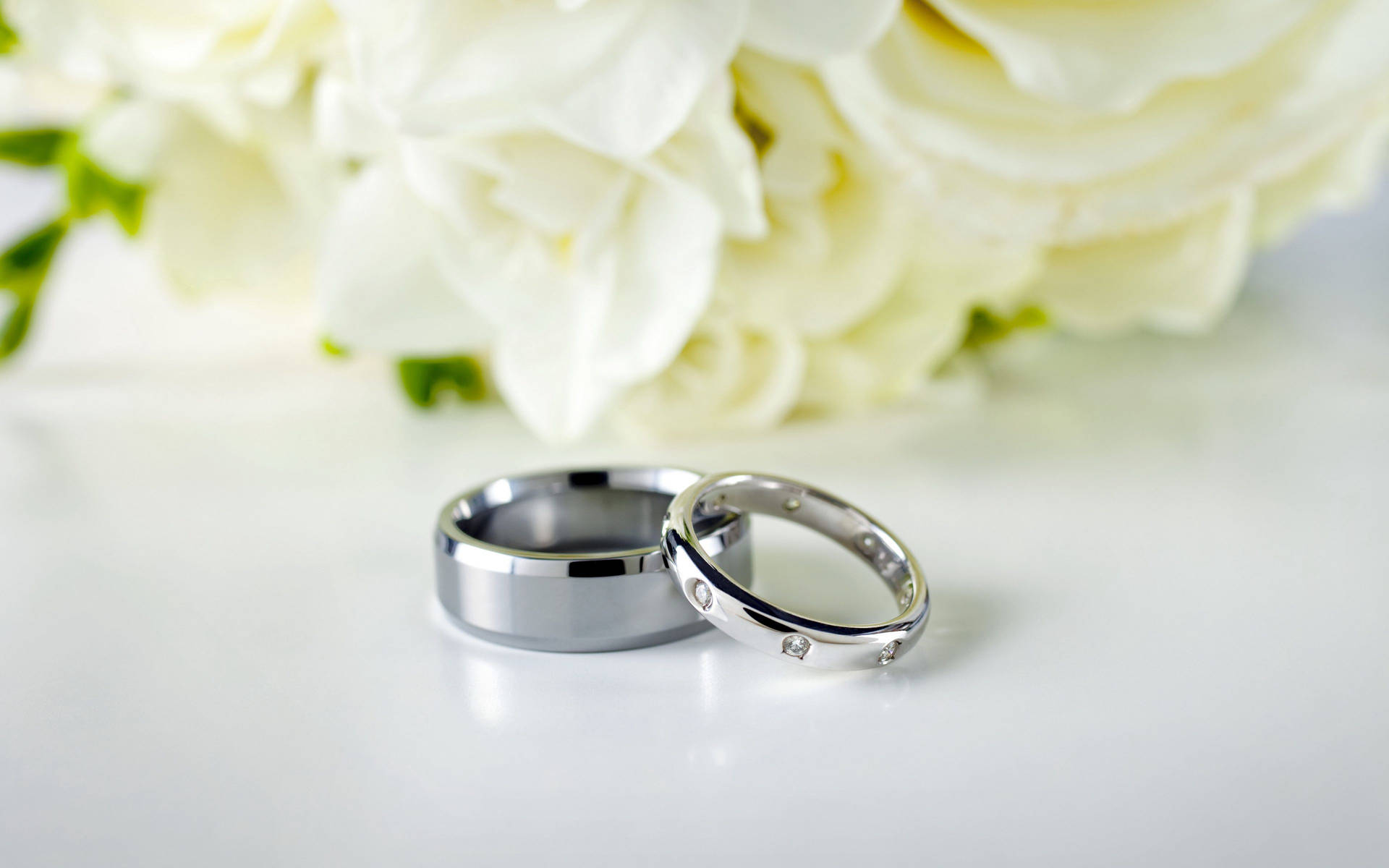 Silver Wedding Rings White Bouquet Background