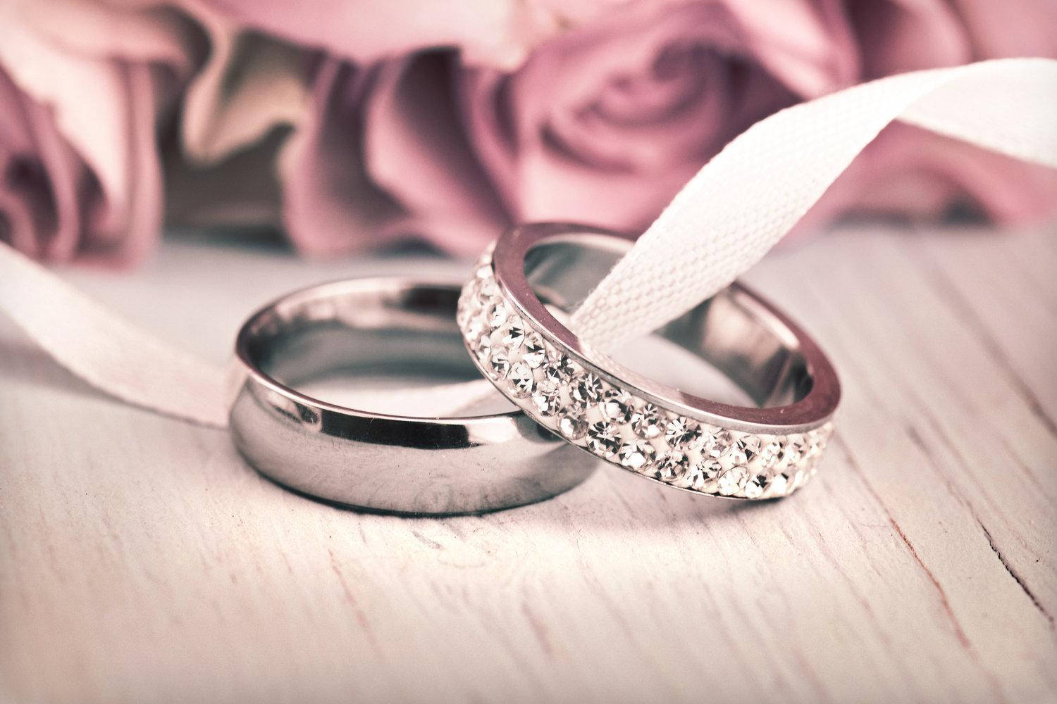 Silver Wedding Rings White Ribbon Background
