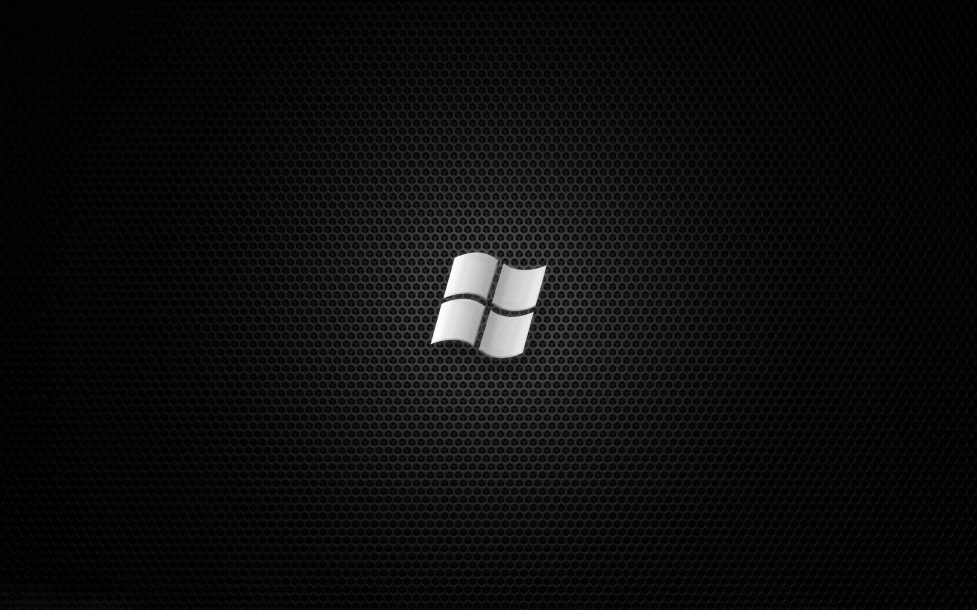 Silver Windows Logo On Black Desktop