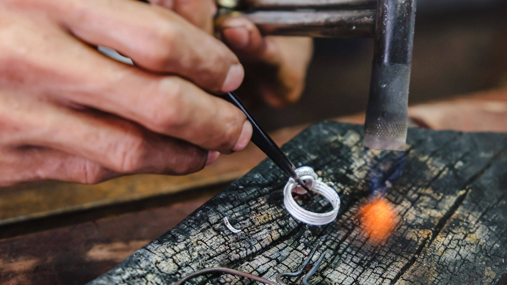 Silversmith With Silver Ring Background