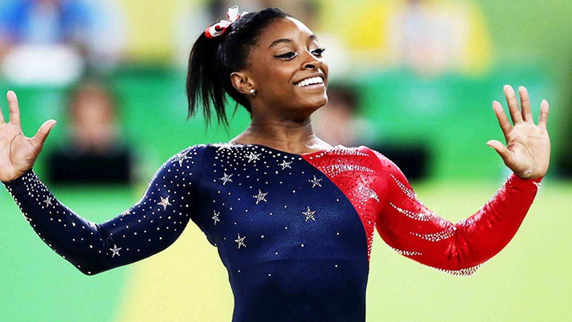 Simone Biles Blue And Red Costume Background