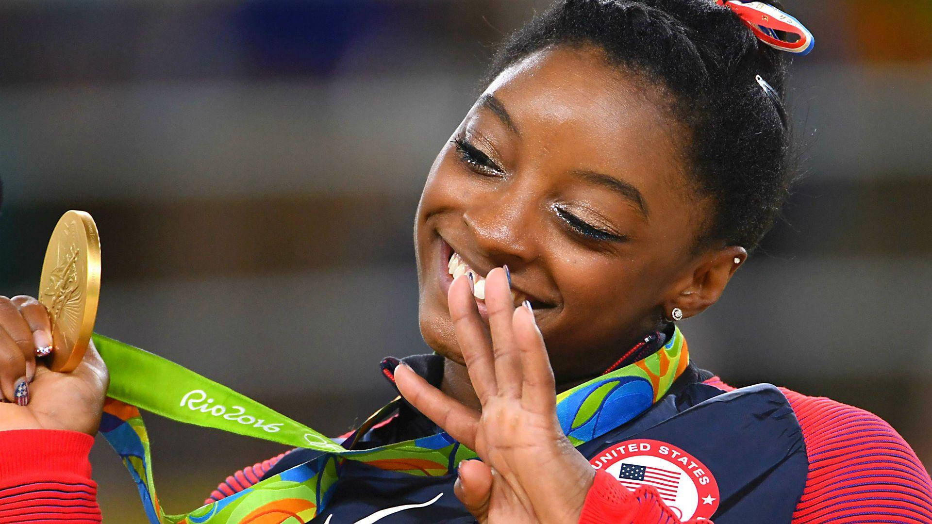 Simone Biles With Gold Medal