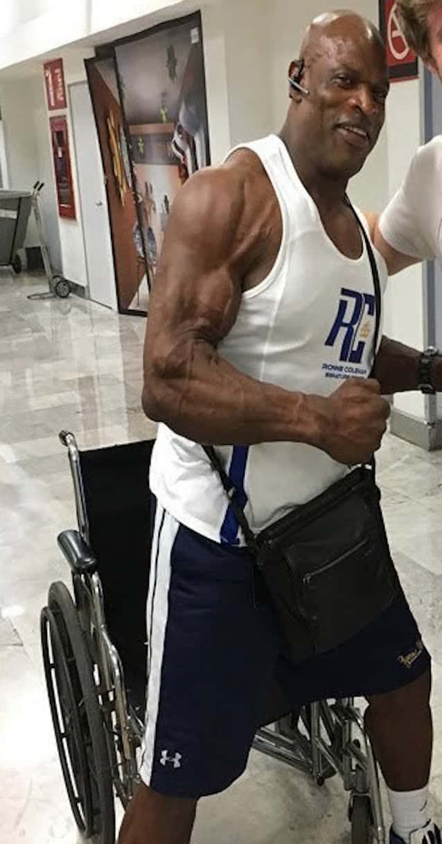 Simple Ronnie Coleman In His Wheelchair Background