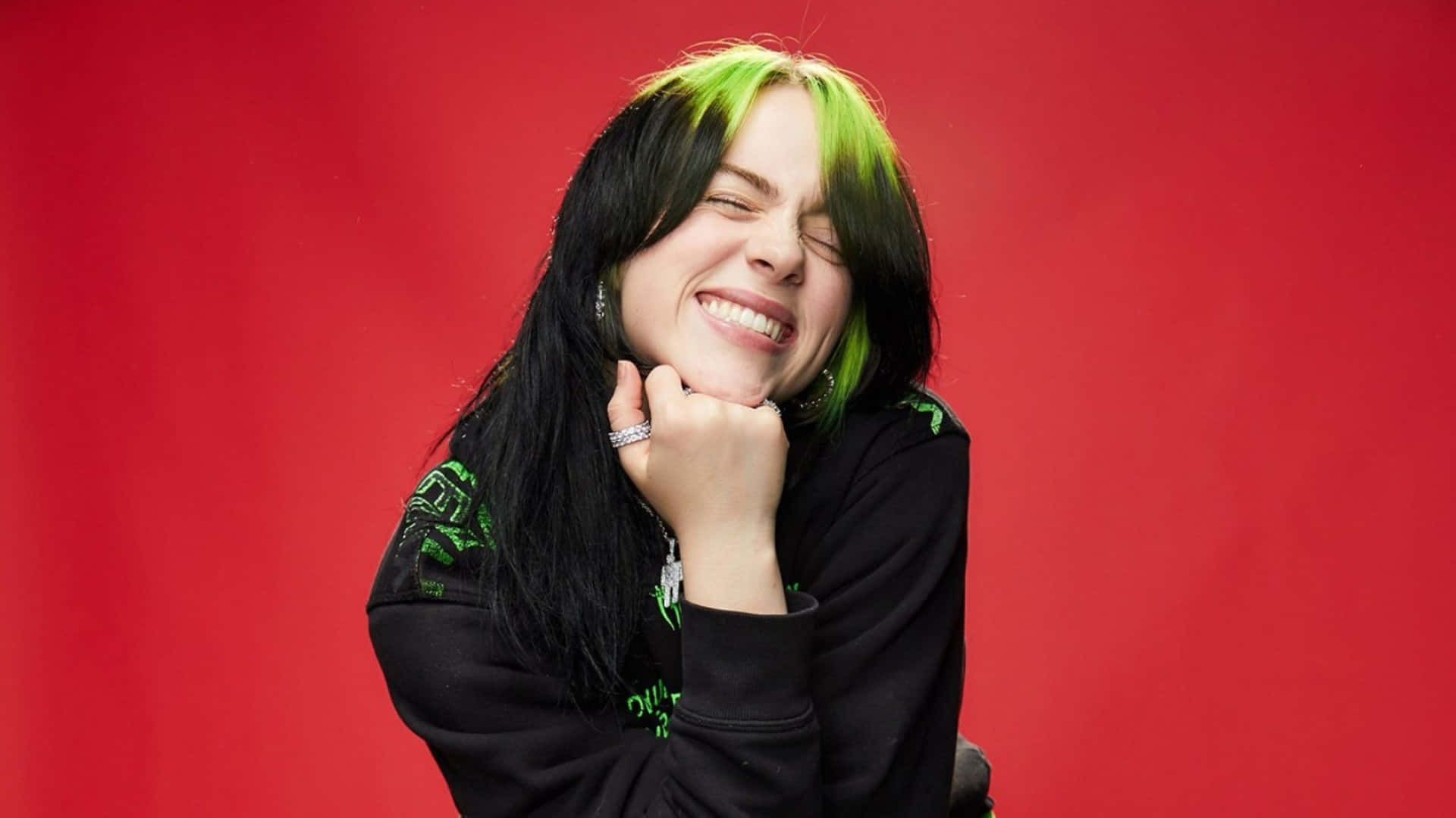 Singer Billie Eilish Working On Her Laptop Background