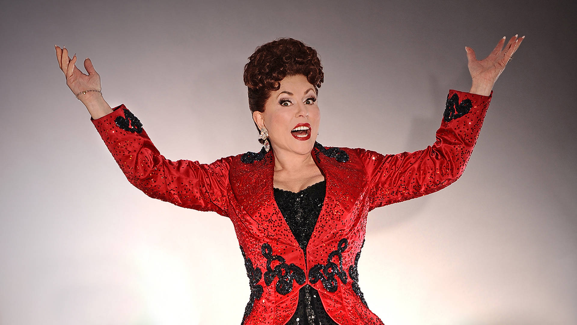 Singer Ethel Merman Performing In Red Background