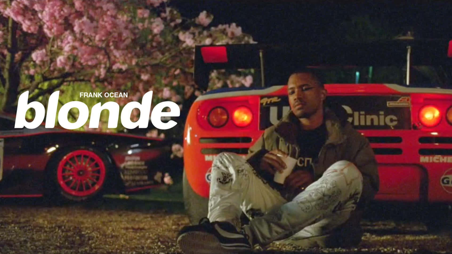 Singer-songwriter Frank Ocean Surrounded By Technology Background
