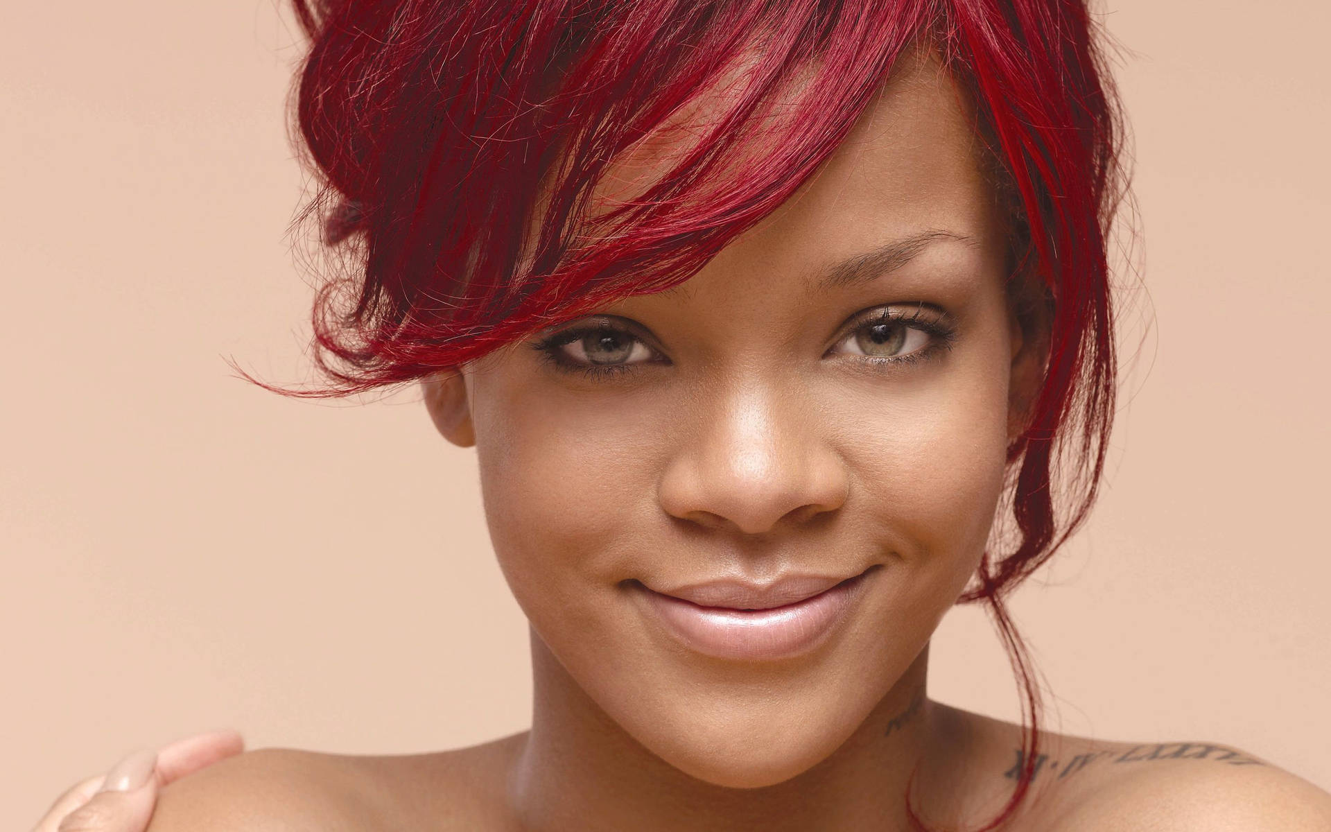 Singer-songwriter Rihanna Smiles Joyfully Background