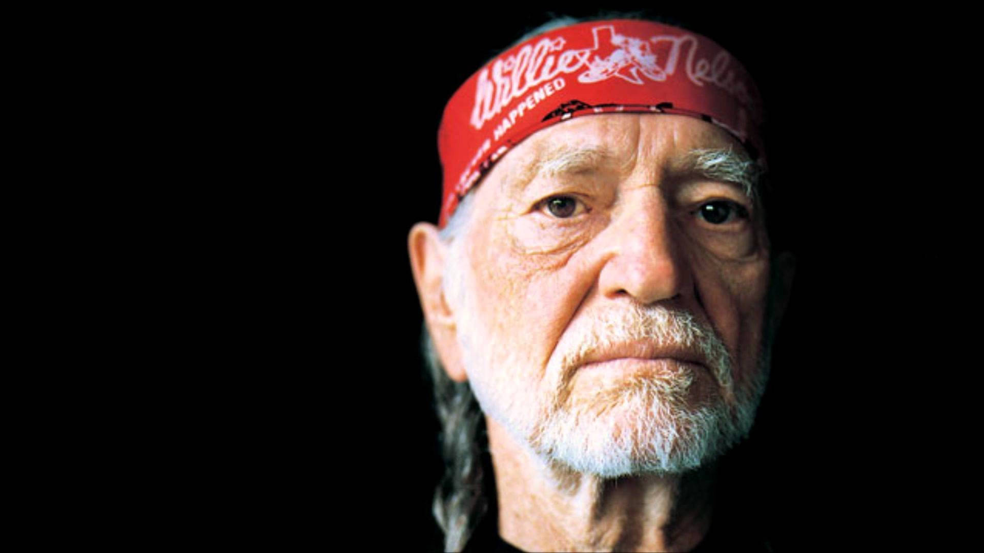 Singer Willie Nelson With Red Bandana Background