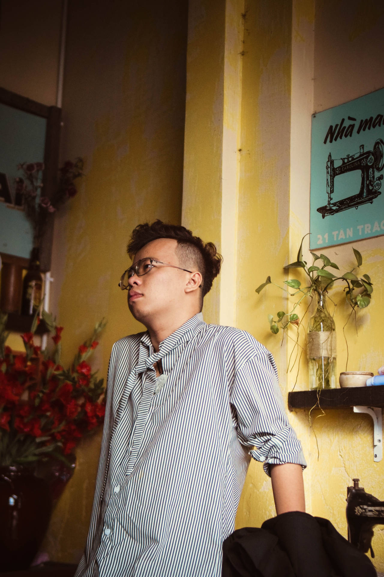 Single Boy On Yellow Painted Wall Background