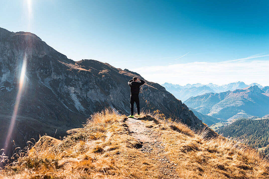 Single Boy Standing On A Mountain