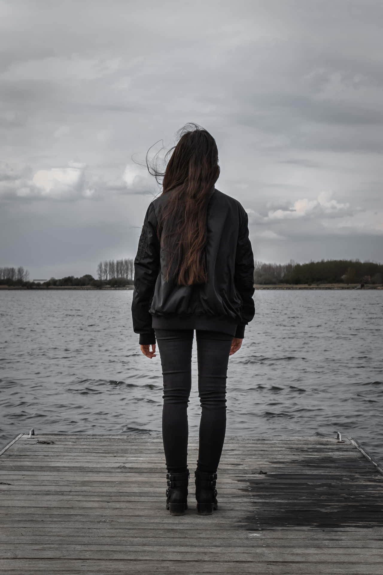 Single Woman In Black By The Lake Background