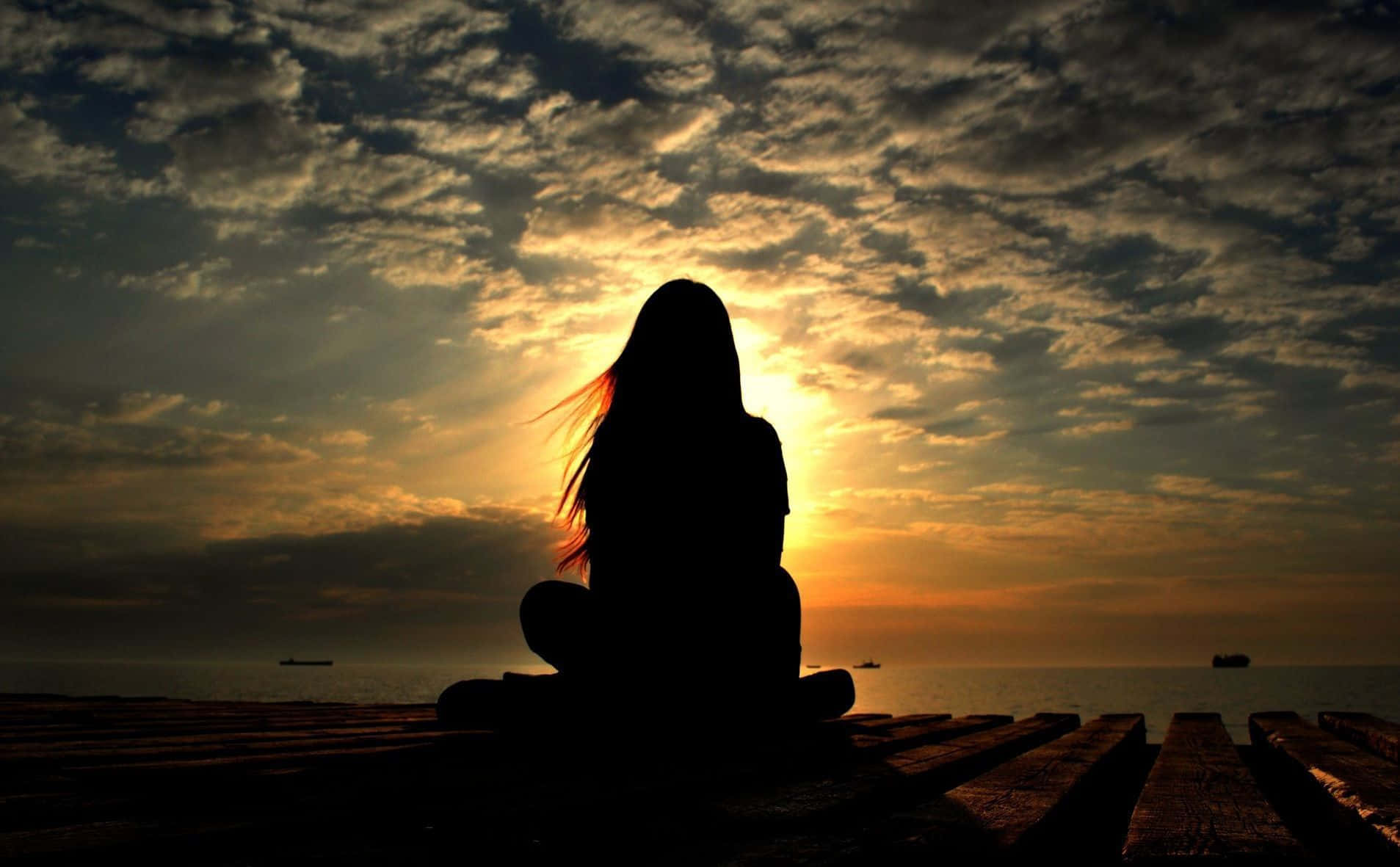 Single Woman Silhouette On A Sunset Background