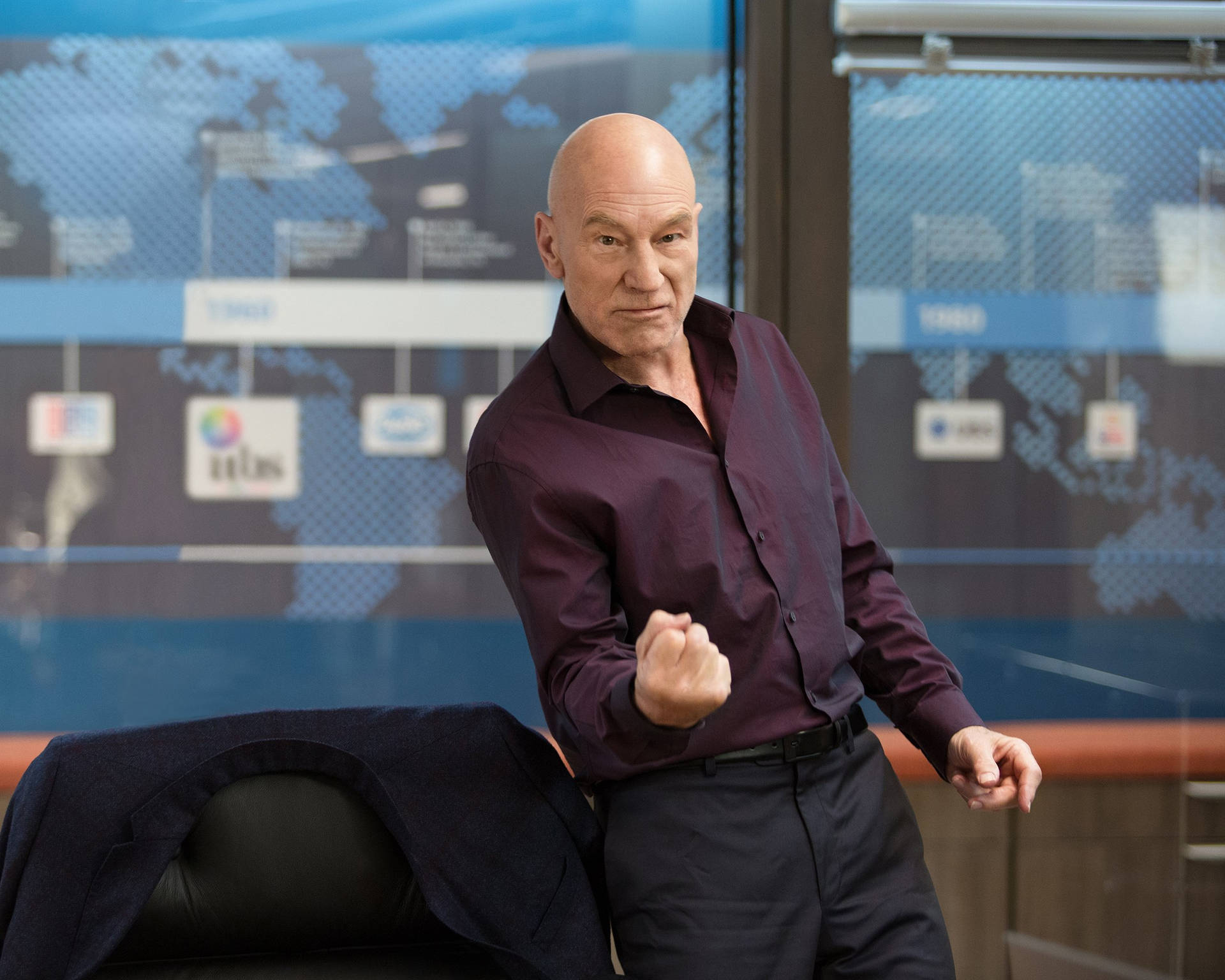 Sir Patrick Stewart, Exuding Ambition And Success In A Powerful Pose Background