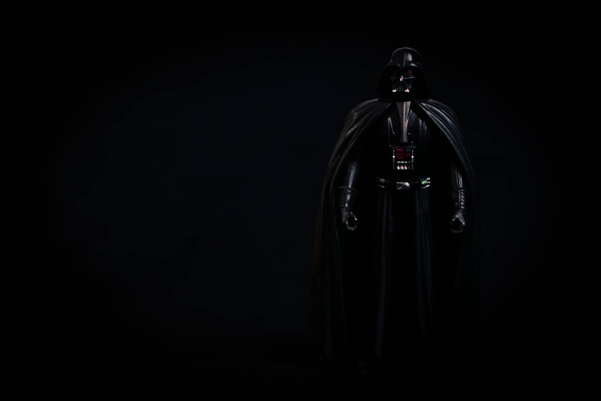 Sith Lord Darth Vader Looms In The Darkness Background