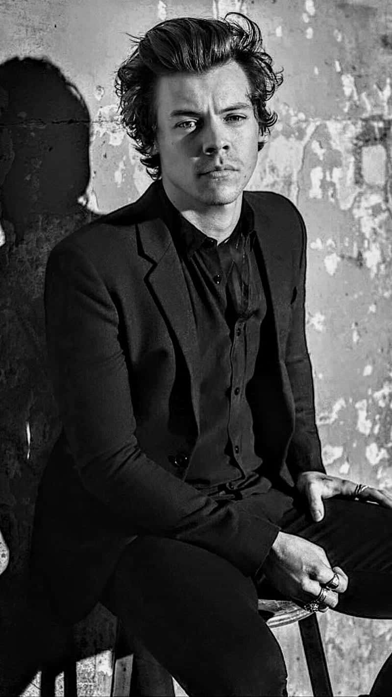 Sitting Harry Styles Black And White Background