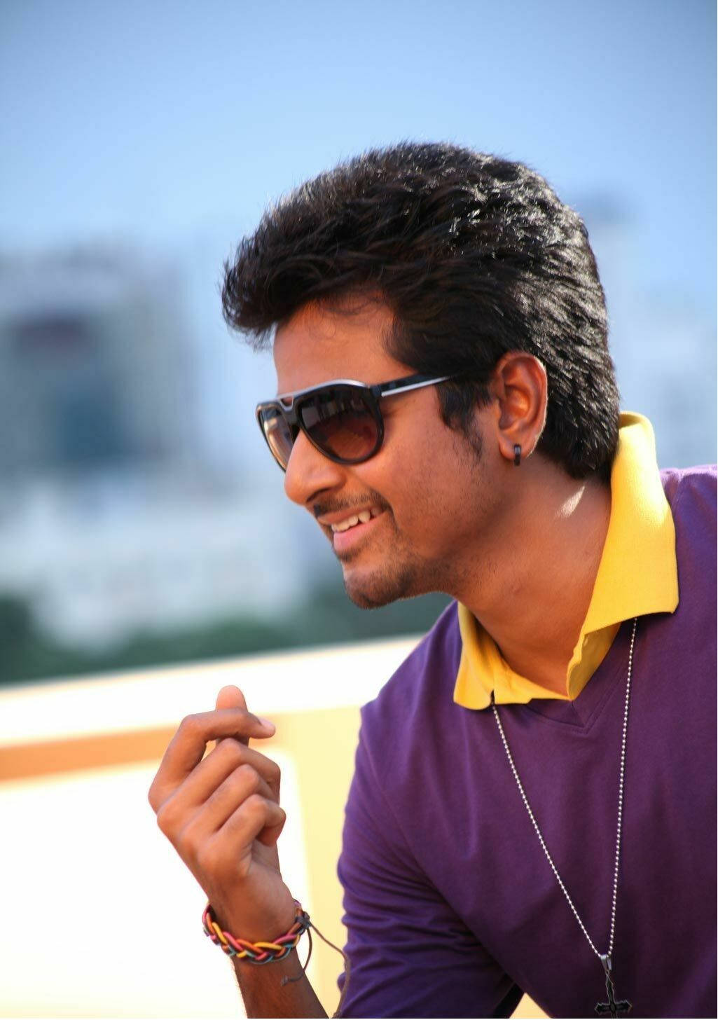 Sivakarthikeyan Exudes Style In A Purple Shirt Background