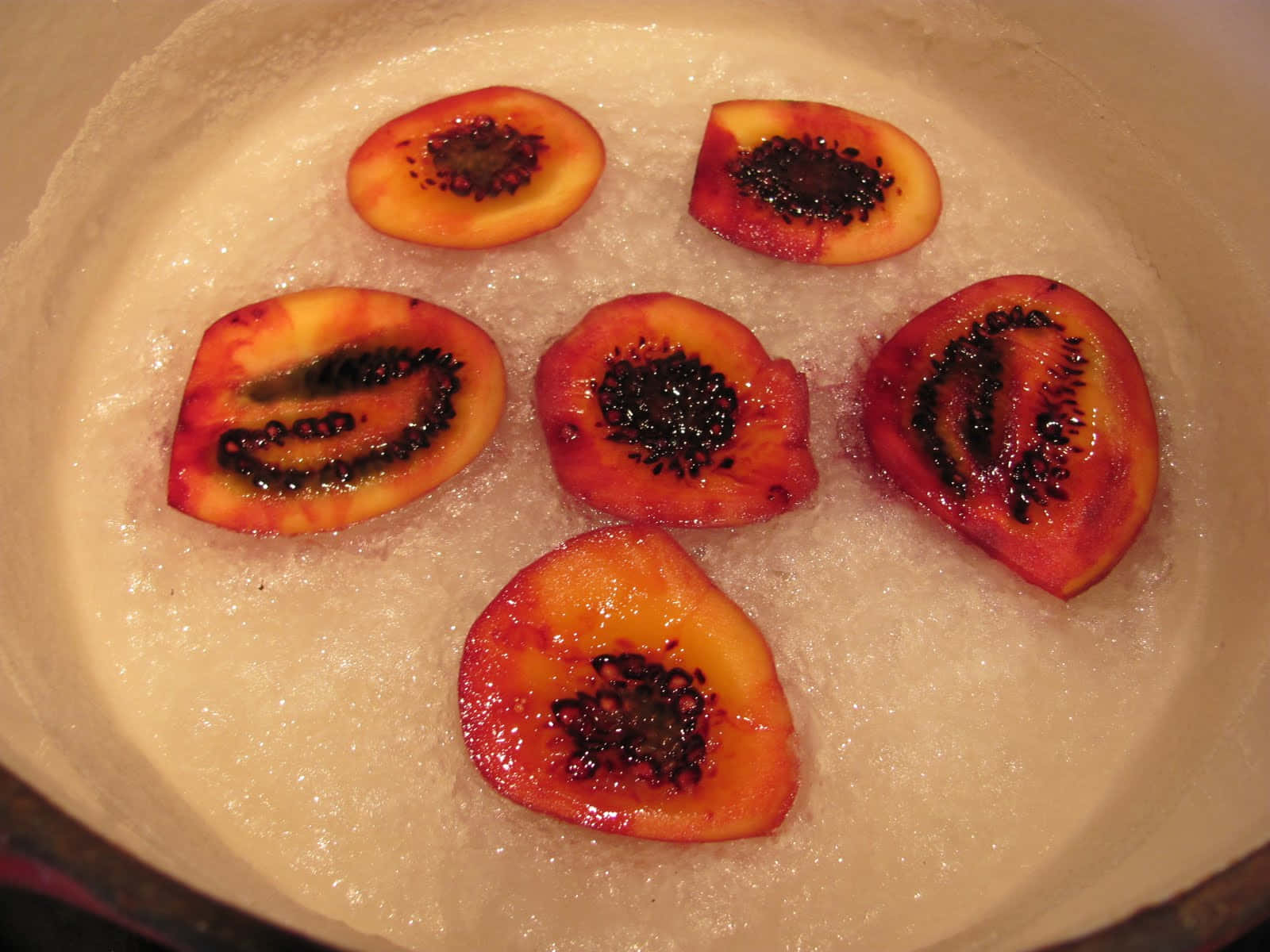 Six Sliced Tamarillo Inside The Bowl With Water