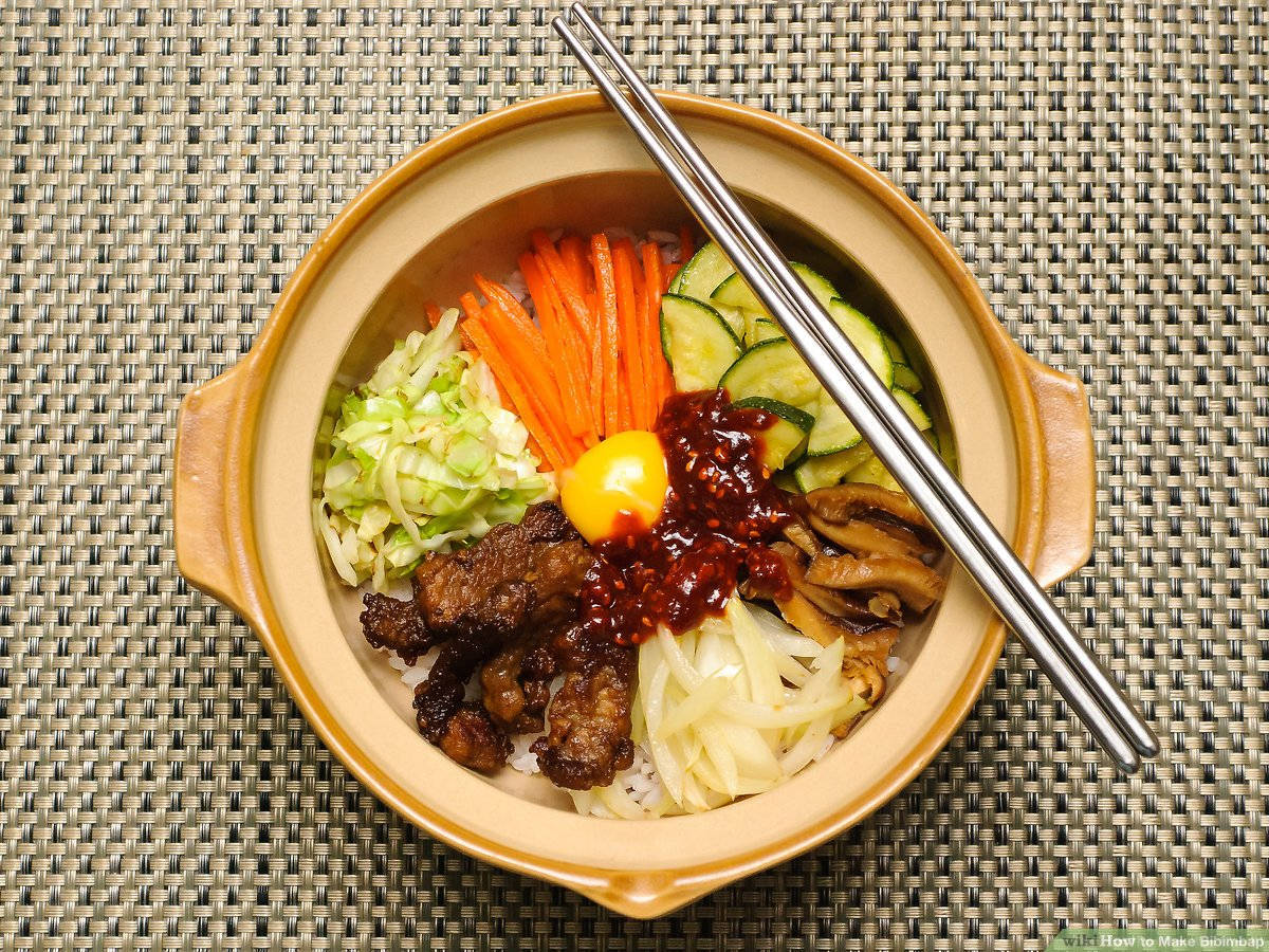 Sizzling Bibimbap In A Hot Pot Background