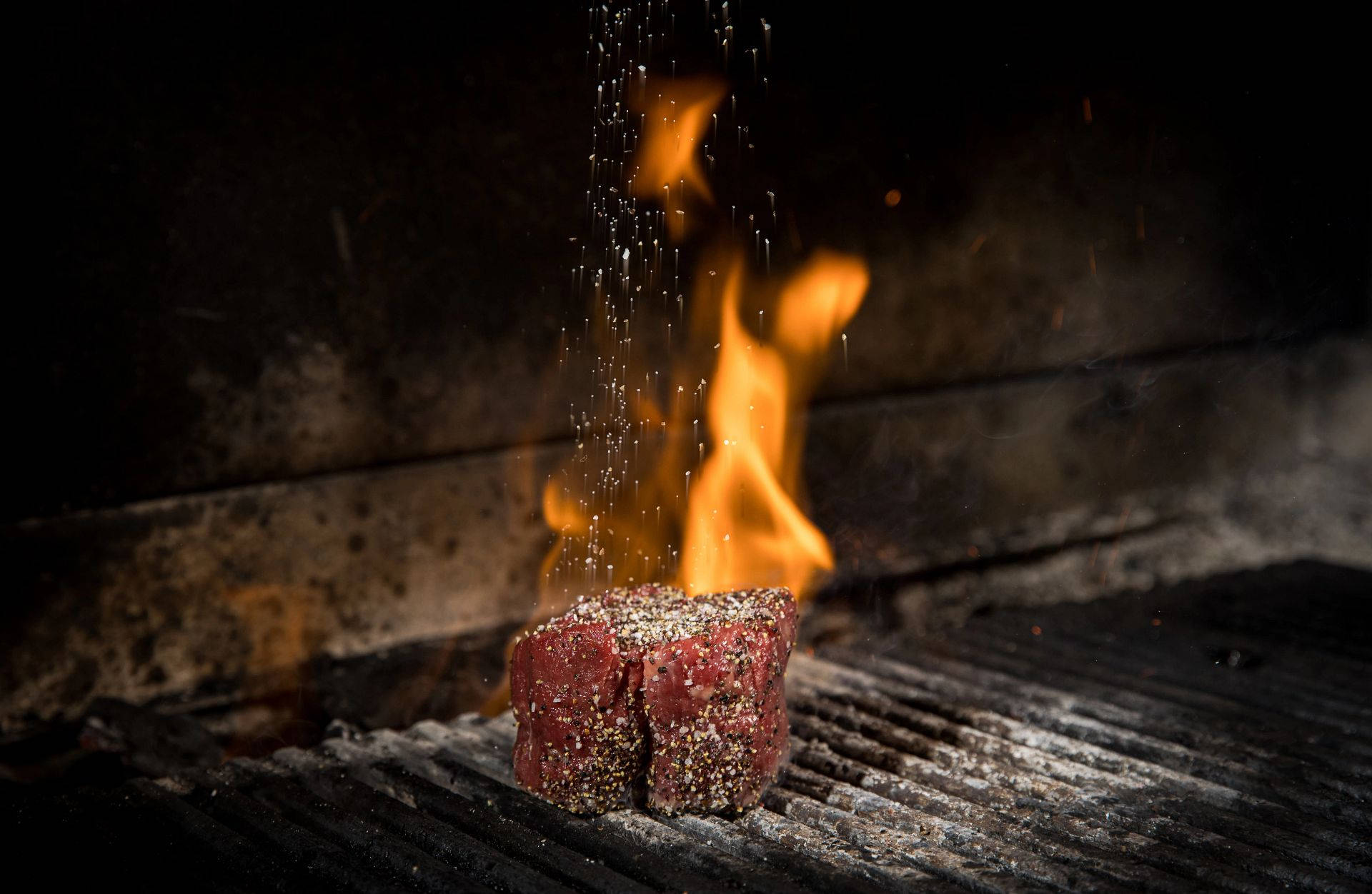 Sizzling Churrasco - Brazilian Barbecue On Flames Background