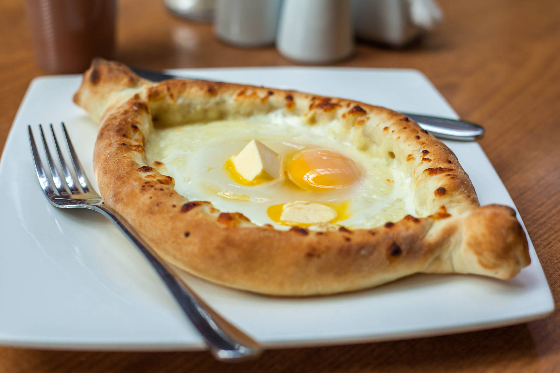 Sizzling Khachapuri Loaded With Melted Cheese And Egg Background