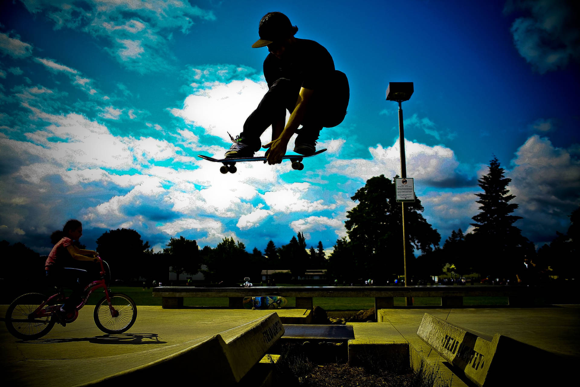 Skateboard Enthusiast Performing Tricks In Silhouette Background