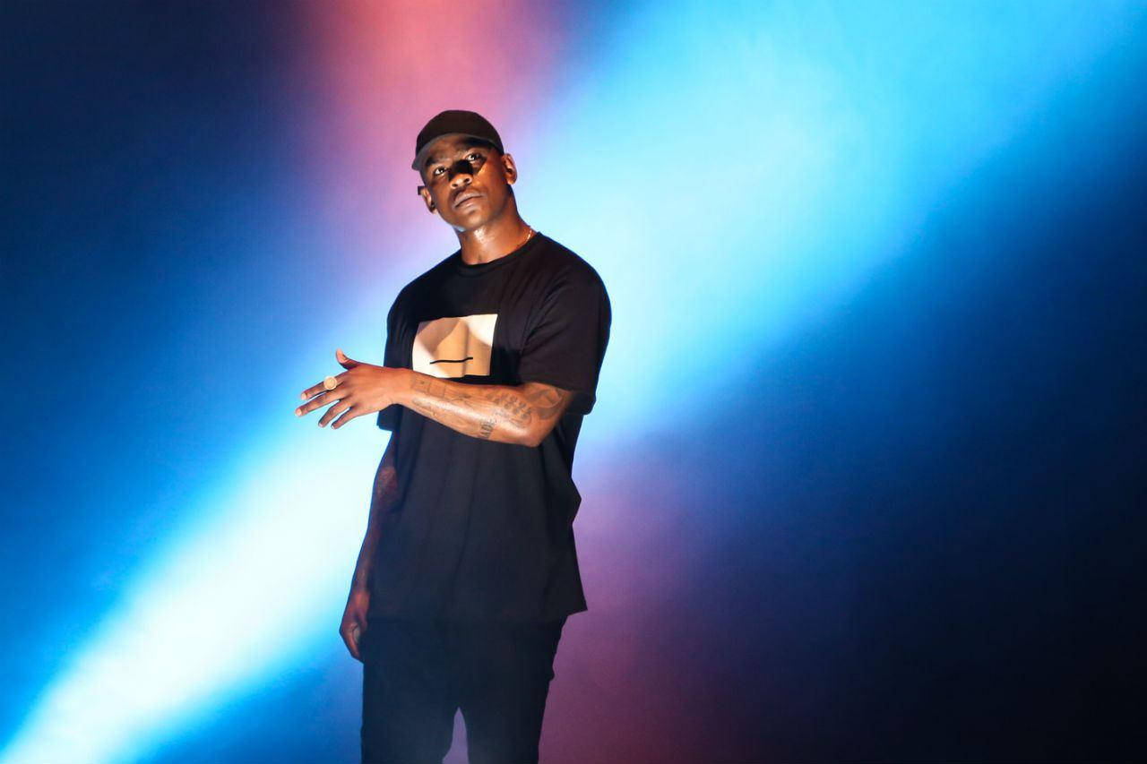 Skepta On Blue Spotlight Background