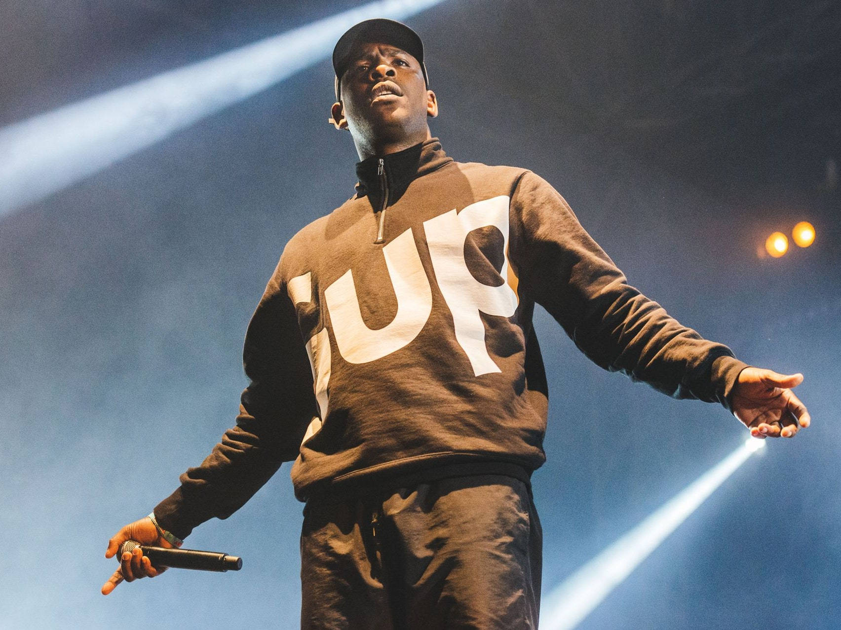 Skepta On Smoky Stage Background