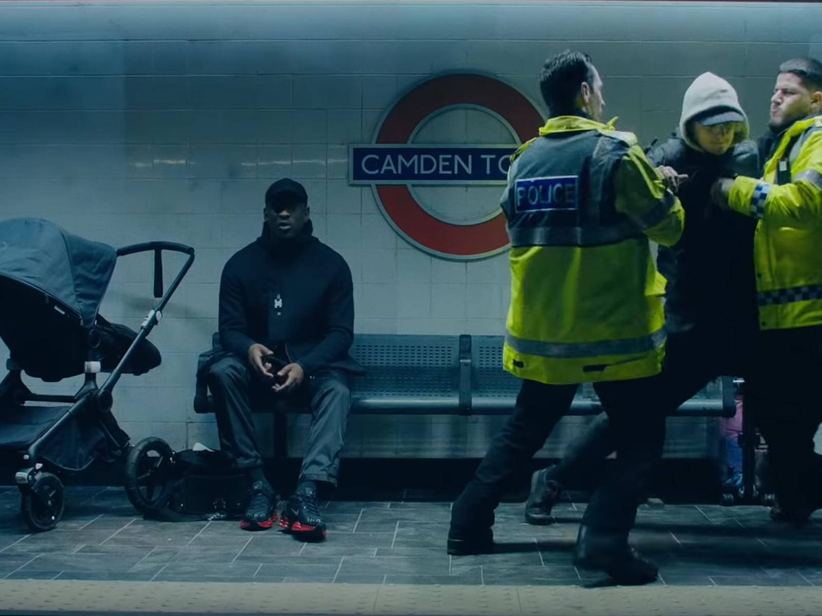 Skepta Sitting On The Subway Bench Background