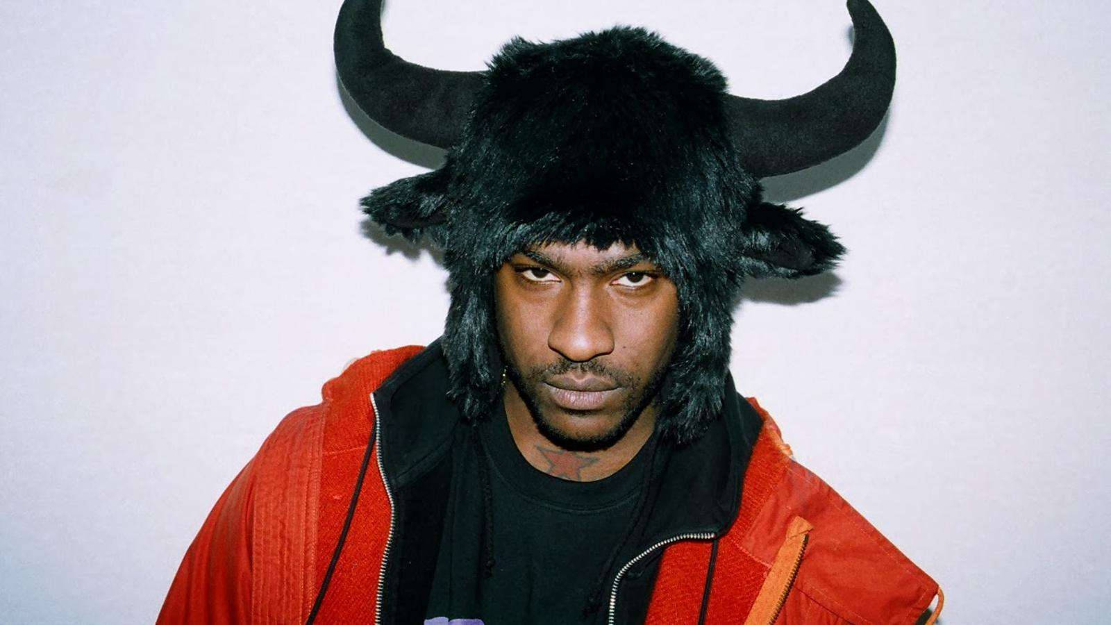 Skepta Wearing Bull Head Cap Background