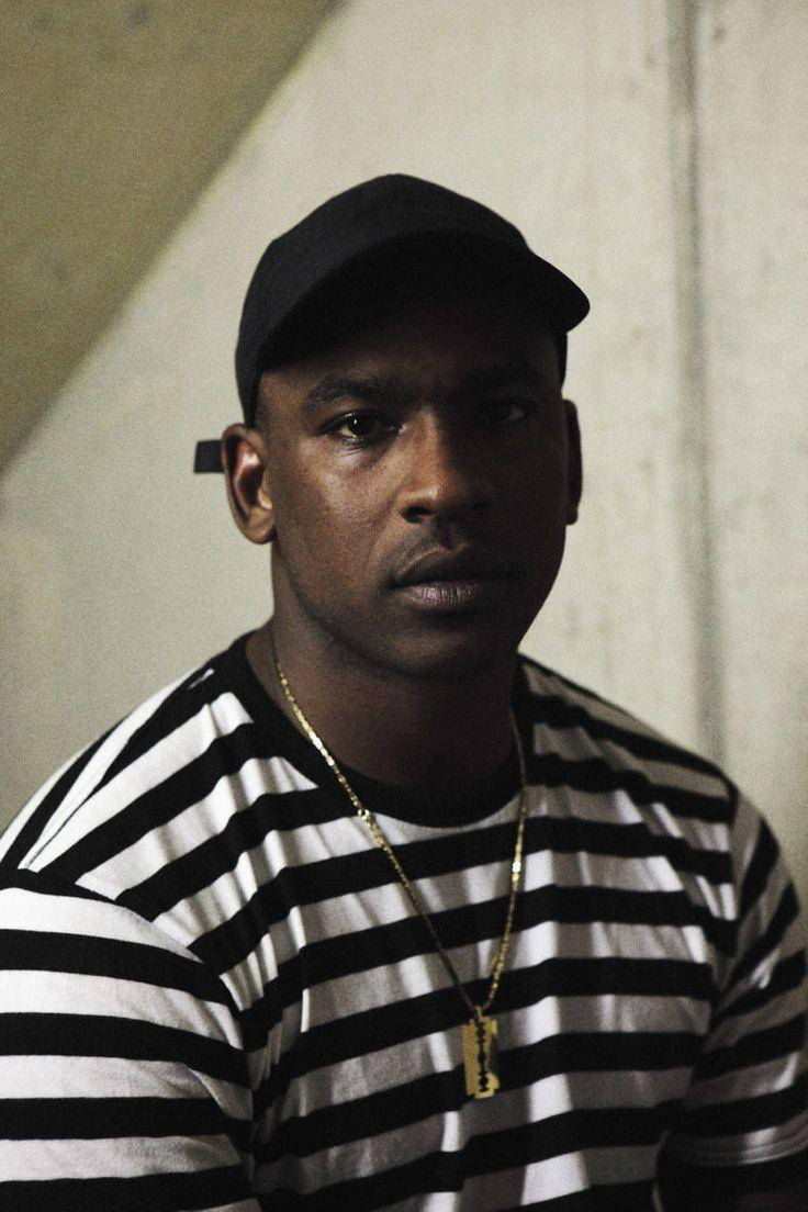 Skepta With Golden Dog Tag Background