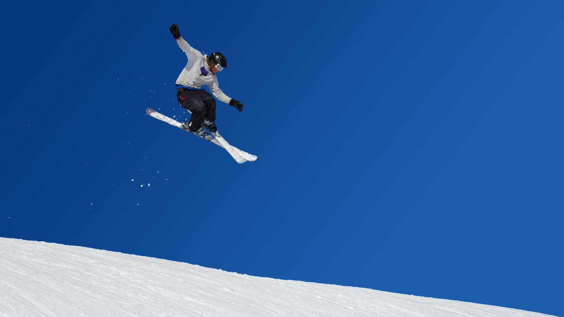 Ski Jumper Mid-air In A Majestic Winter Environment