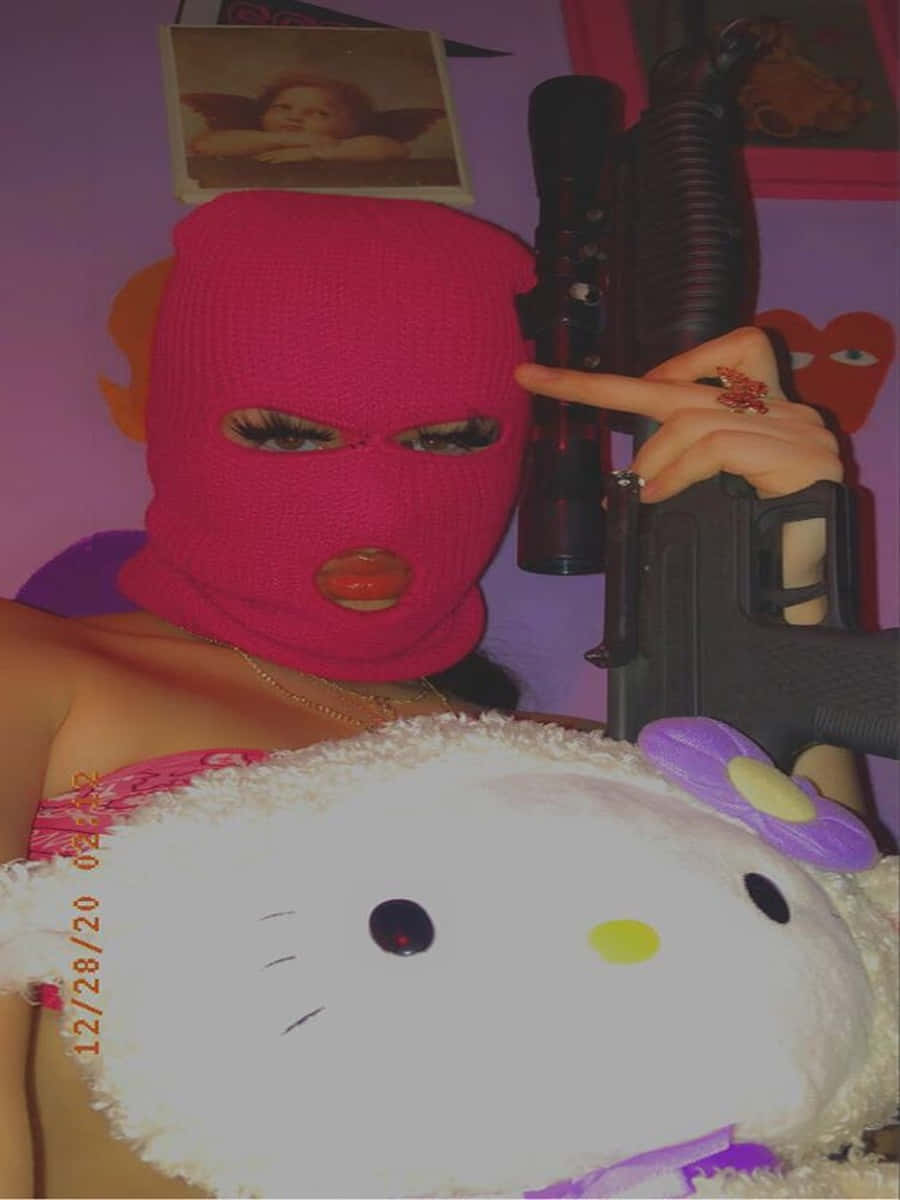 Ski Mask Girl With Gun And Hello Kitty Doll Background