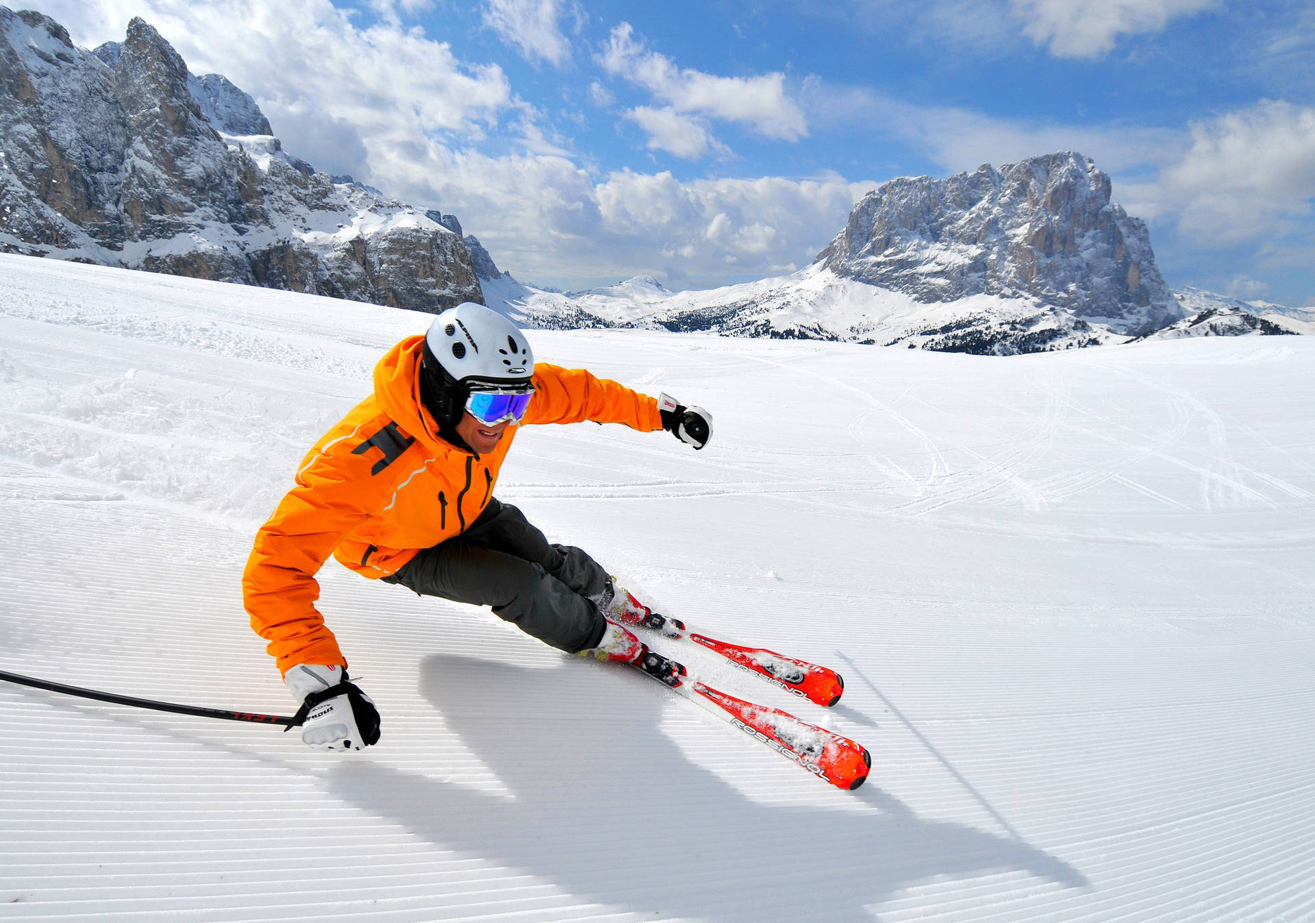 Skier Mastering The Alpine Slopes Background