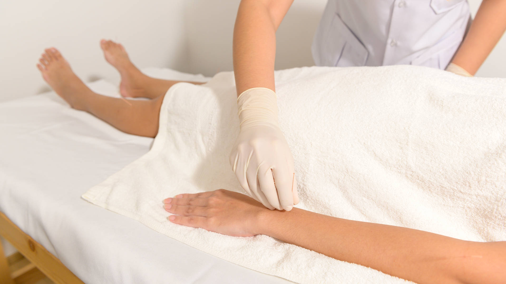 Skilled Acupuncturist Performing Needle Insertion