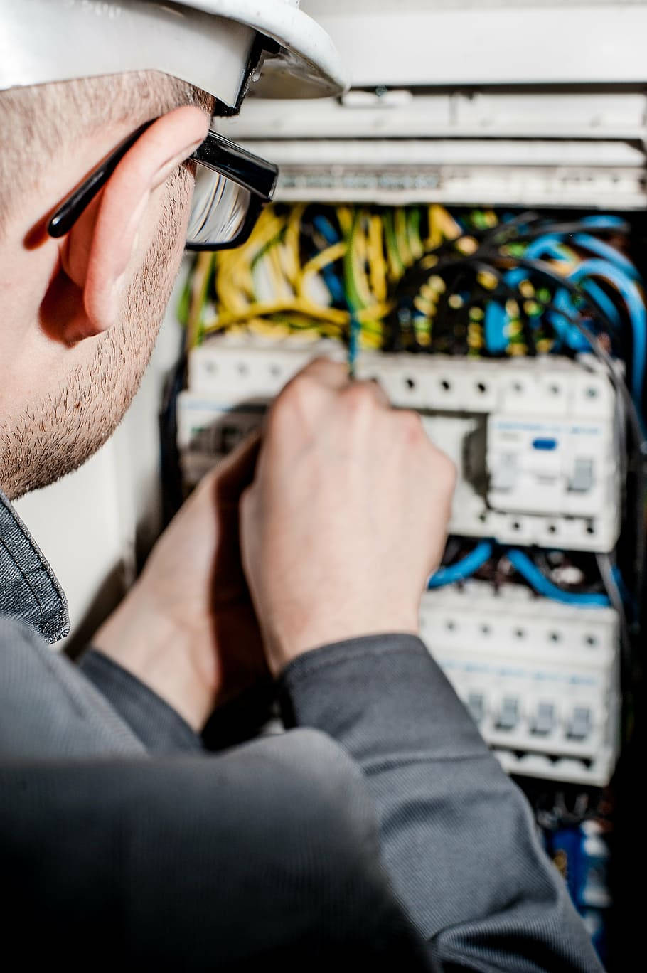 Skilled Electrician Installing Wires Background